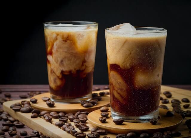 clear drinking glasses with iced coffee