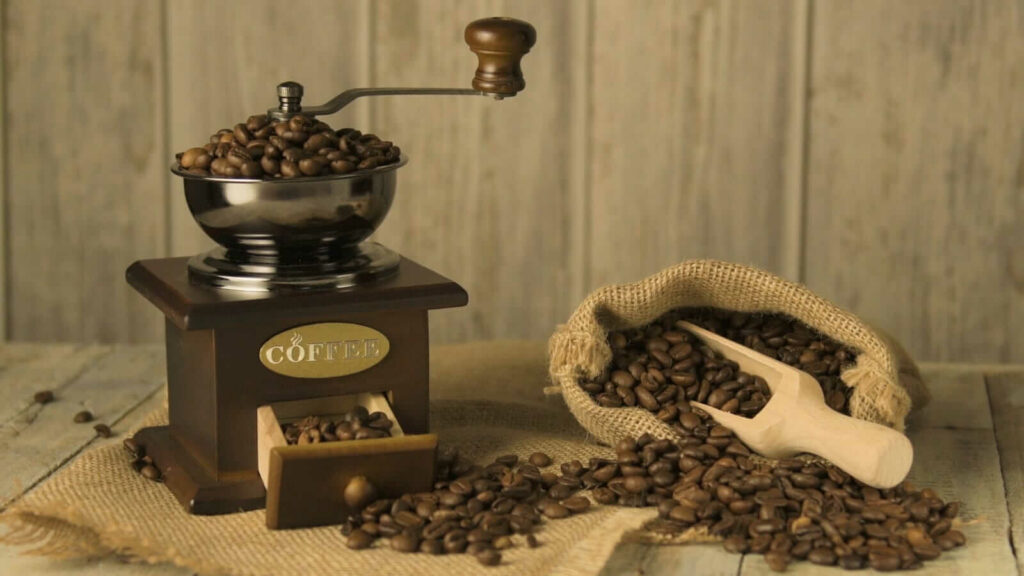 Coffee beans on old fashioned wooden table